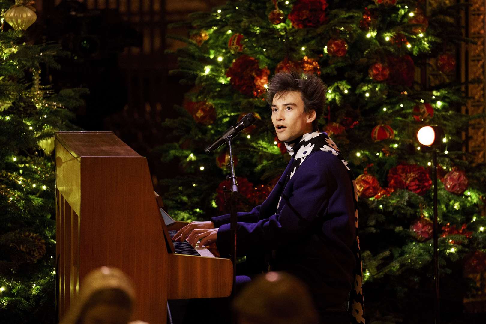 Jacob Collier performs during the Royal Carols – Together At Christmas service at Westminster Abbey on John Lennon’s former piano (Jordan Pettitt/PA)