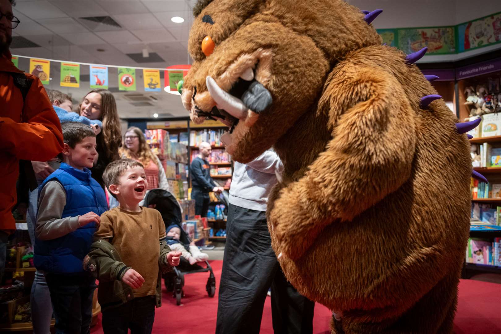 One youngster is excited to meet a favourite storybook hero. Picture: Callum Mackay.