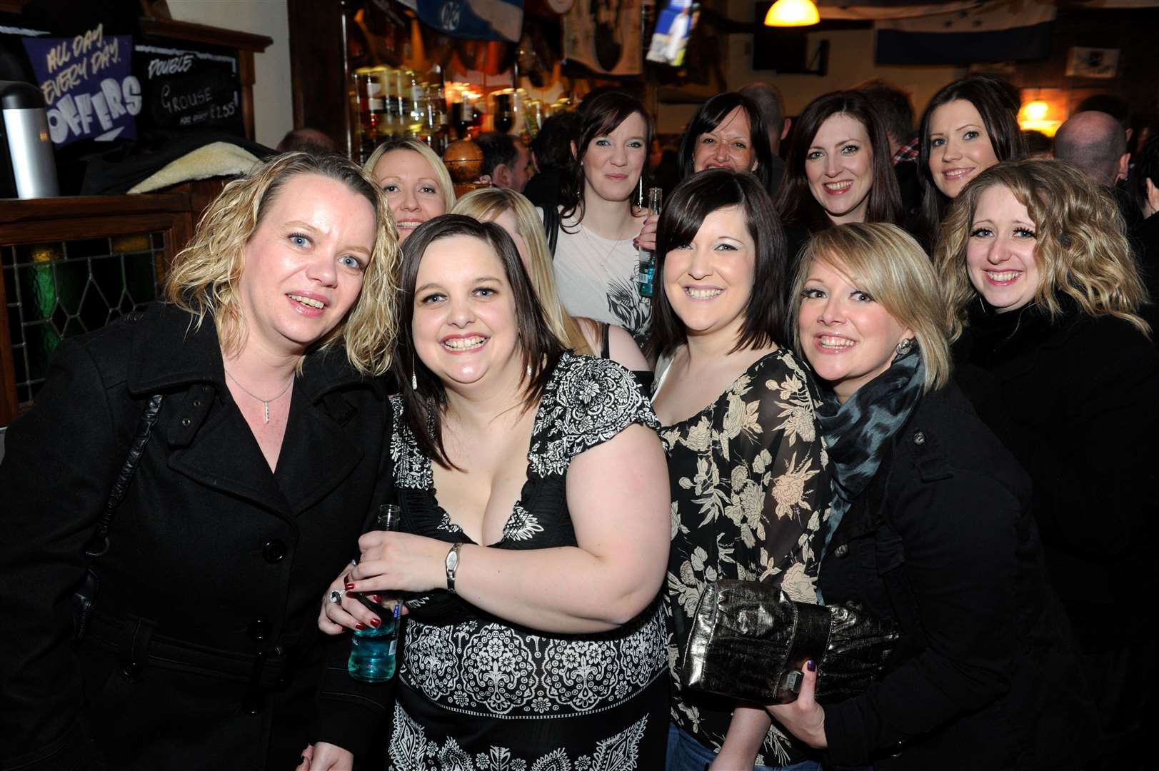 Michelle Fraser (centre) celebrates her 25th birthday with friends and family.