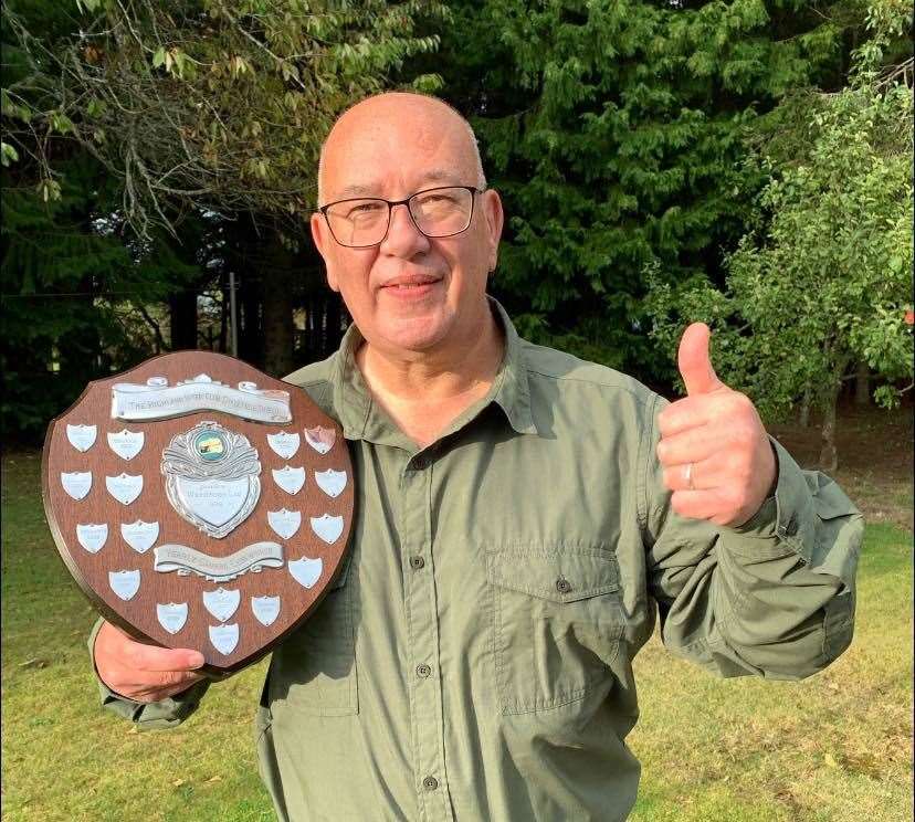 Owen Cochrane, president of Inverness Camera Club, with the Highland Challenge Shield.