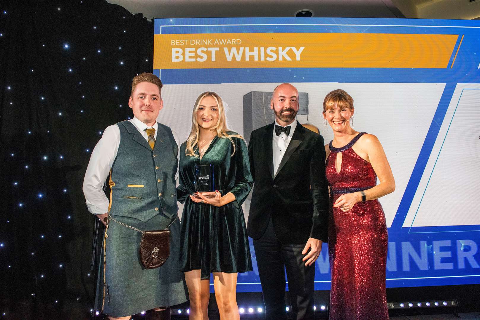 Julia Mackillop and Scott Adamson from Tomatin distillery collecting the Best Whisky award for Cu Bocan single malt. Pictures: Chris Watt Photography.