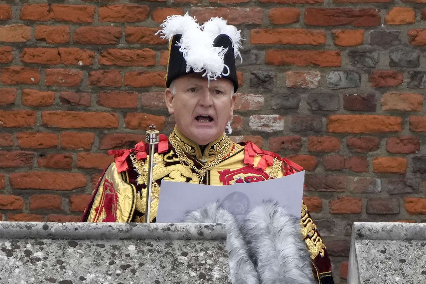 Garter Principle King of Arms, David Vines White reads the proclamation of new King, King Charles III, from the Friary Court balcony (Kirsty Wigglesworth/PA)