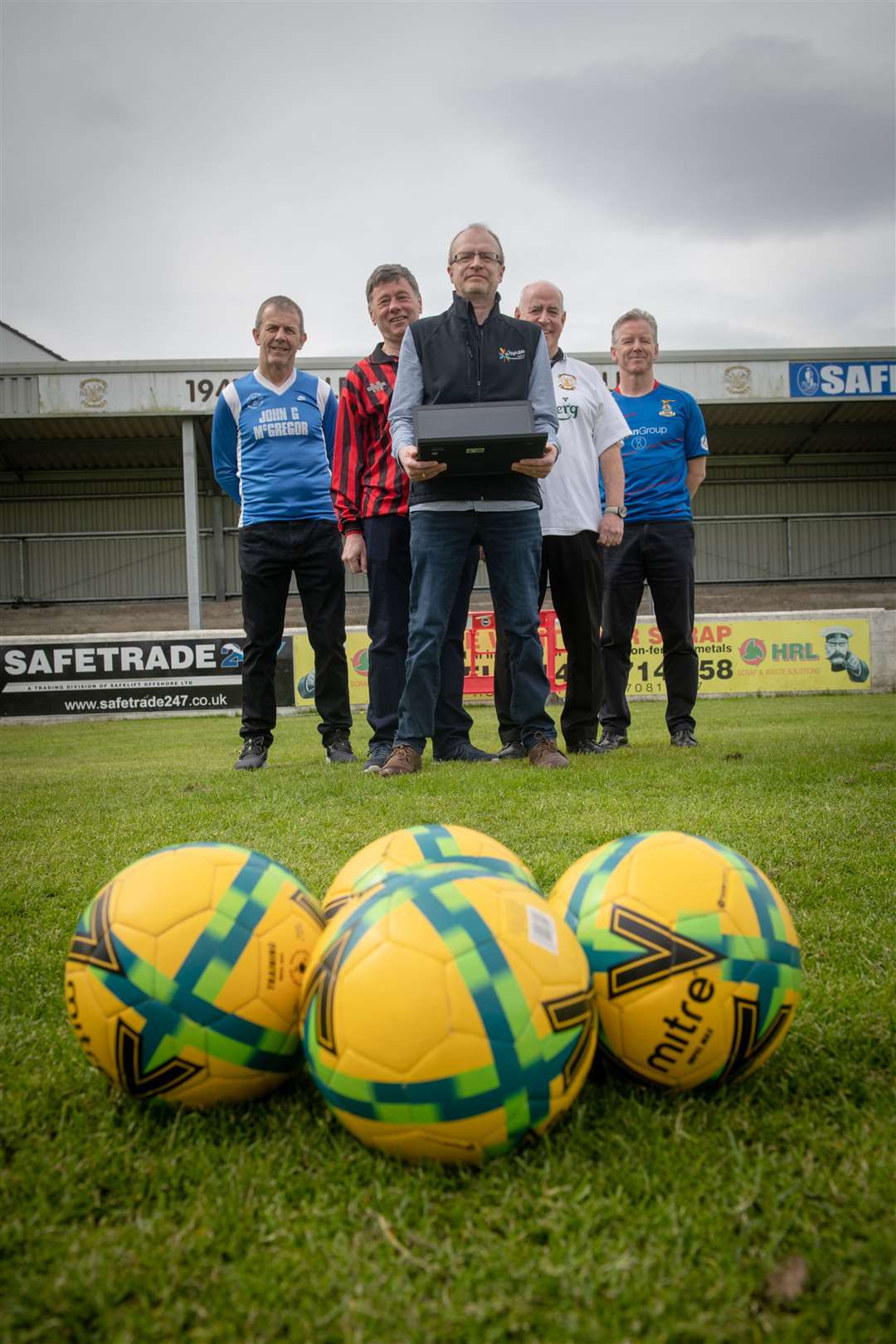 Preparing for the launch of Inverness Football Memories Project are Jamie Gaukroger, of High Life Highland (centre) with former players Roddy Davidson, David Milroy, Peter Corbett and Charlie Christie.