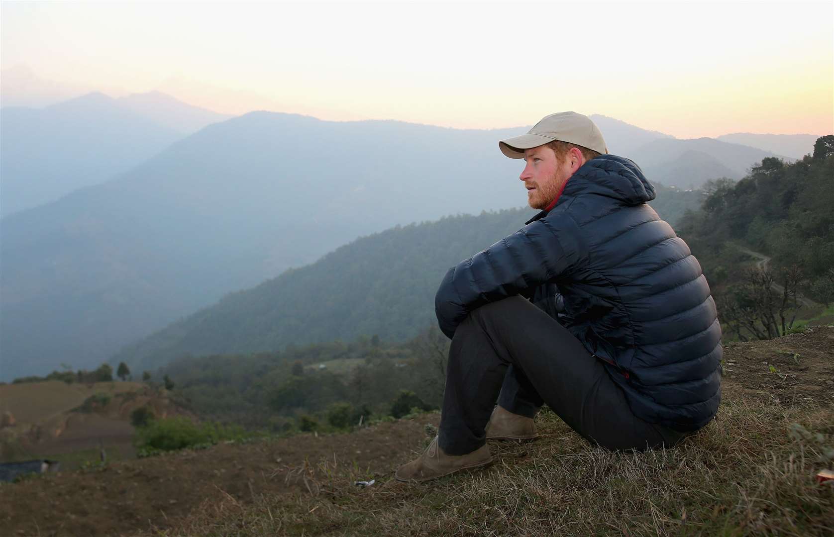 Harry watching the sun rise after spending the night in the Himalayan hilltop village of Leorani on his visit to Nepal (Chris Jackson/PA)