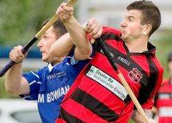 Glen's David Smart (right) battles with Kilmallie's Liam Cameron. Pic by Neil G Paterson