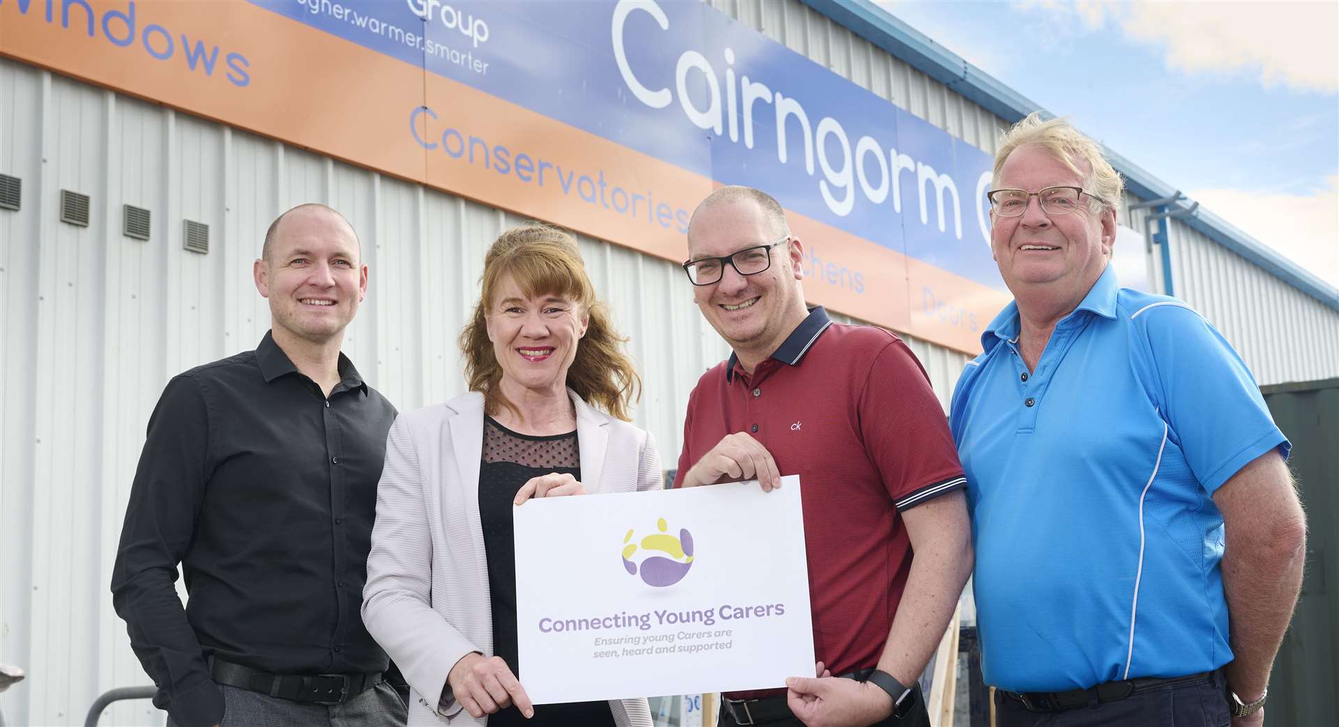 Roisin Connolly, chief executive of Connecting Carers, with (left to right) Scott and Chris Dowling, joint managing directors, Cairngorm Group, and David Dowling, group chairman.