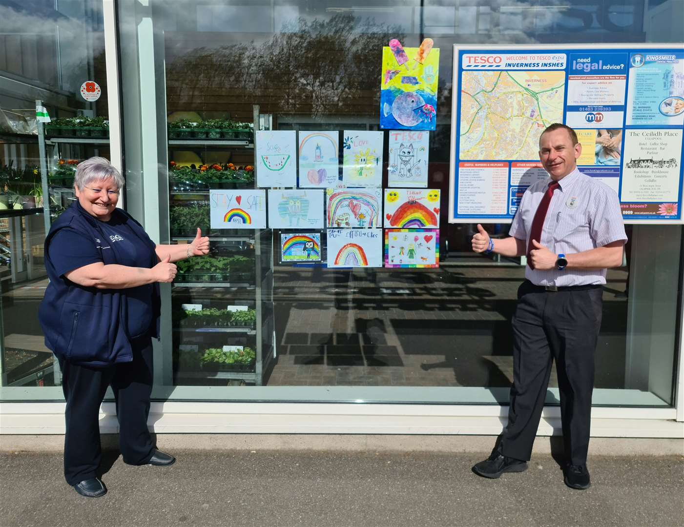 Tesco Inshes community champion Shona Patience and store team manager Paul Queen with the early art contributions.