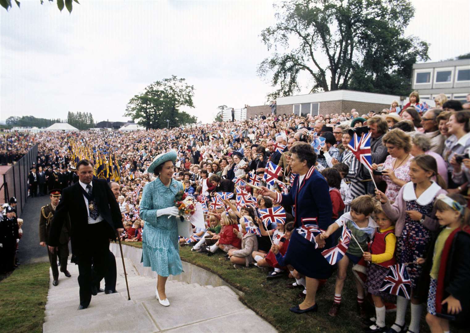 Greeted by huge crowds on a sports field at Butterley Hall, near Chesterfield, during her Silver Jubilee tour in 1977 (Ron Bell/PA)