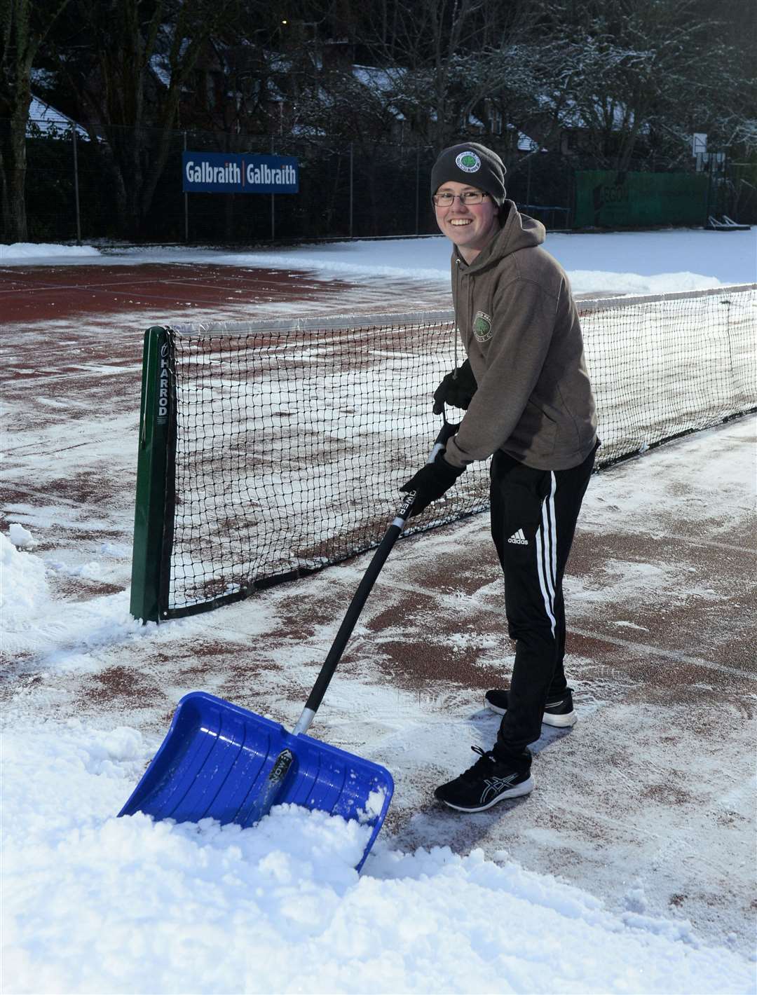 No stopping coach practice at Bellfield Park Tennis Club due to snow..Coach Scott Munro hard at work clearing the court..Picture: Gary Anthony..