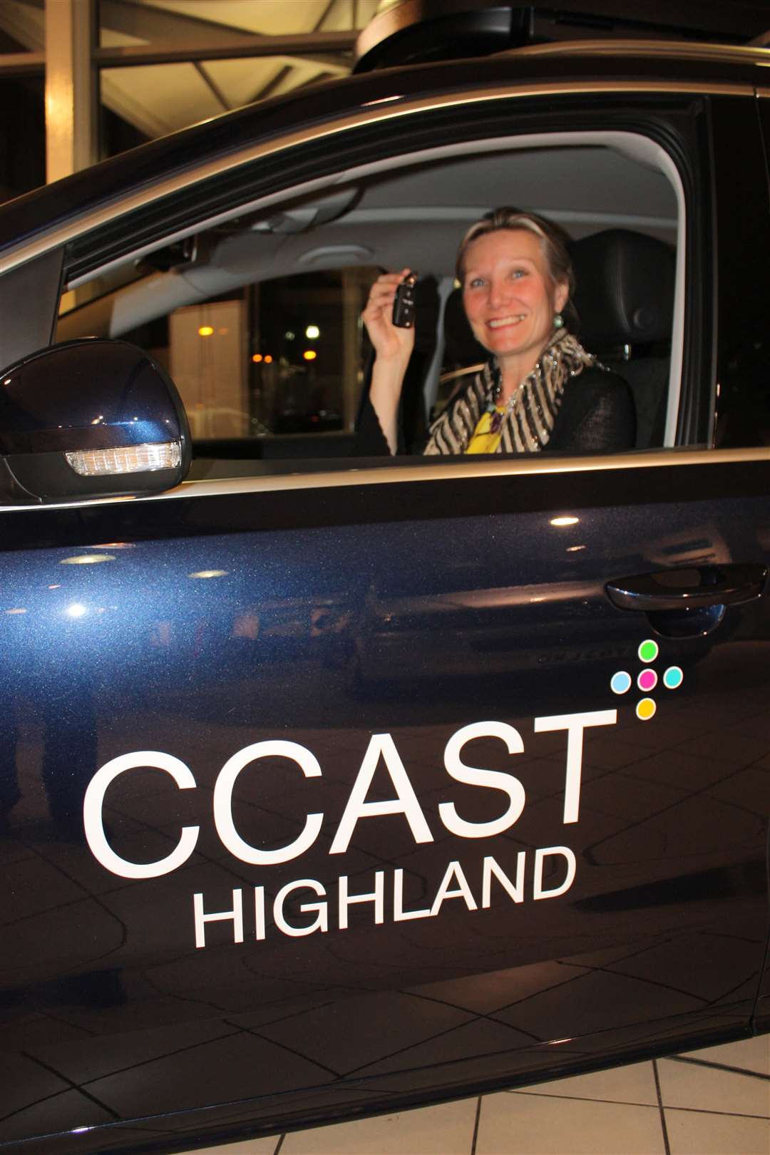 Amanda Nutt of CCAST Highland with the charity's vehicle gifted by the Highland Cross in 2013.