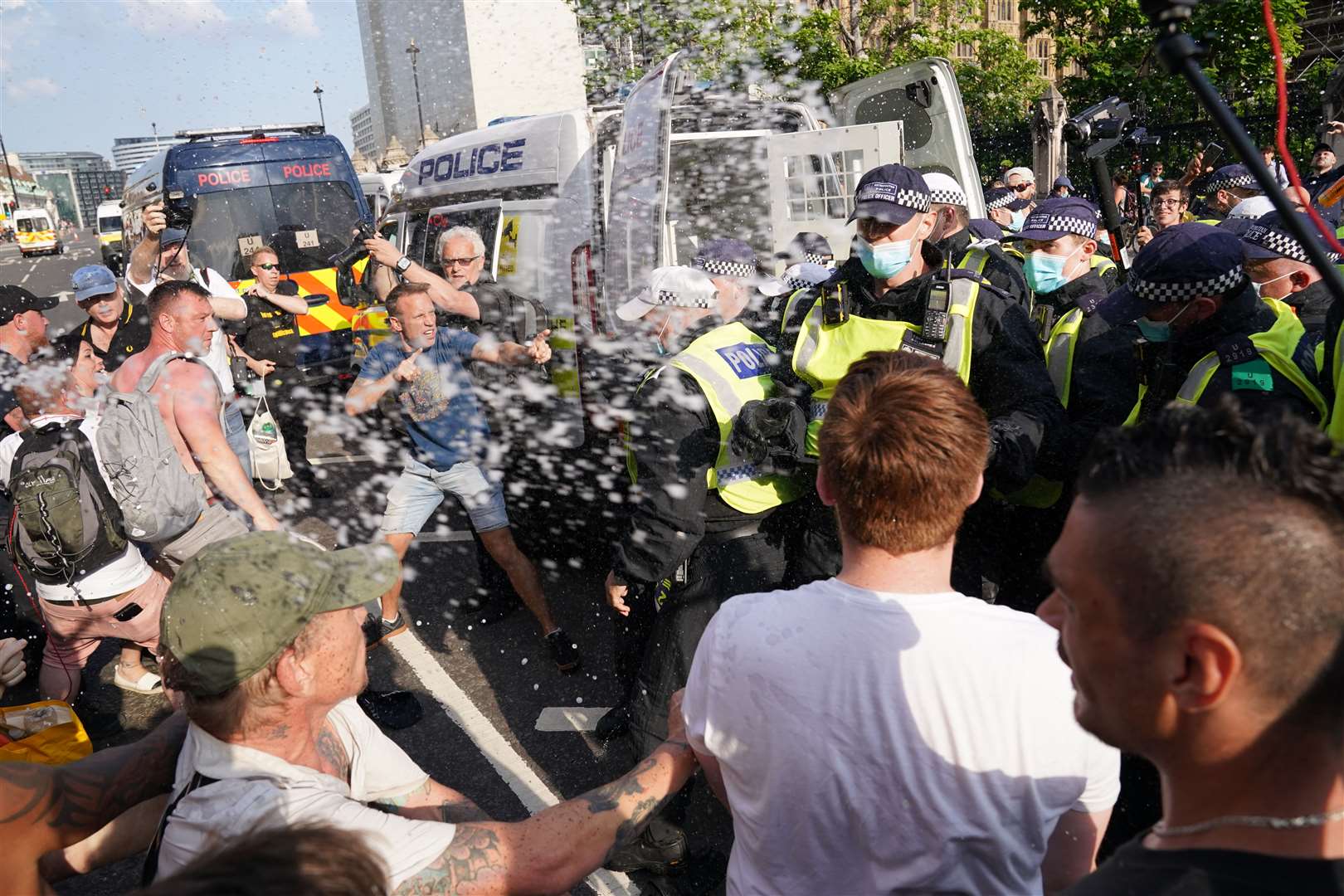 Police and protesters face each other in Parliament Square (Jonathan Brady / PA)