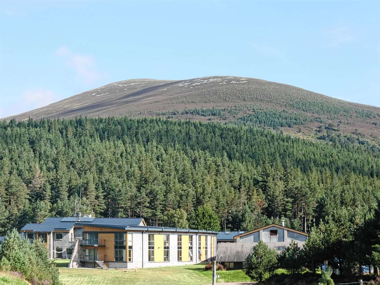 Glenmore Lodge with Meall a' Bhuachaille behind.