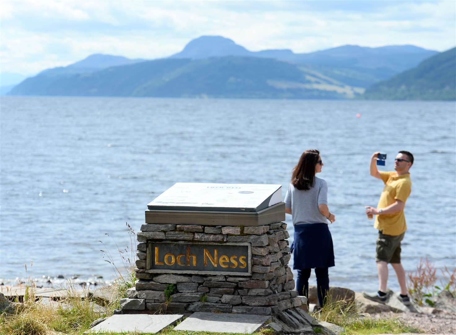 Visitors at Dores beach, Loch Ness continues to be big attraction for tourists.