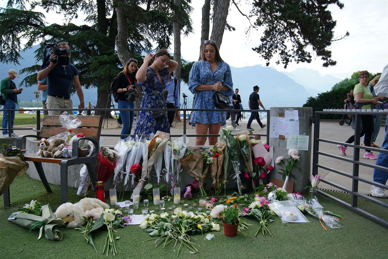 Tributes left near the scene at a lakeside park in Annecy, France, following a knife attack (Peter Byrne/PA)