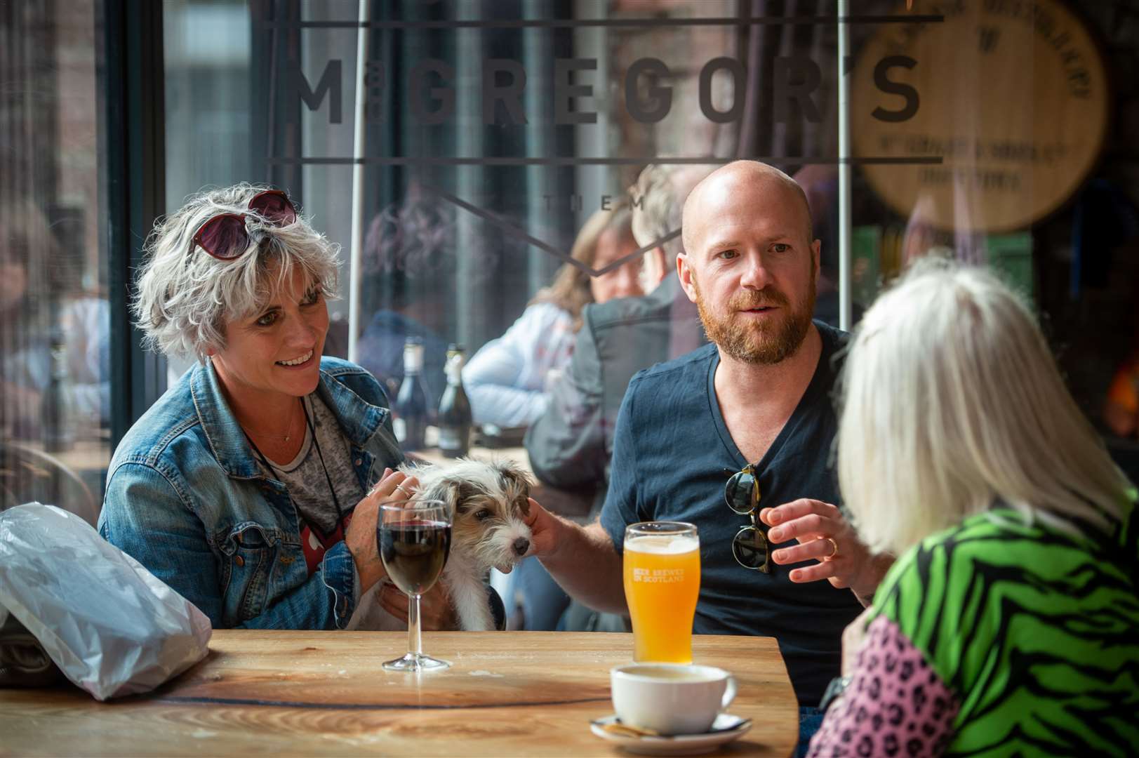 Makeup artist Sam Whitby with husband Keith and Bea the dog at MacGregors bar. Picture: Callum Mackay.