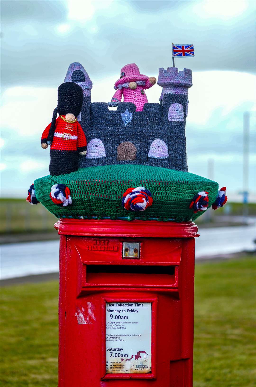 A knitted topper of the Queen and Windsor Castle has been placed on a post box in New Brighton, Wirral (Peter Byrne/PA)
