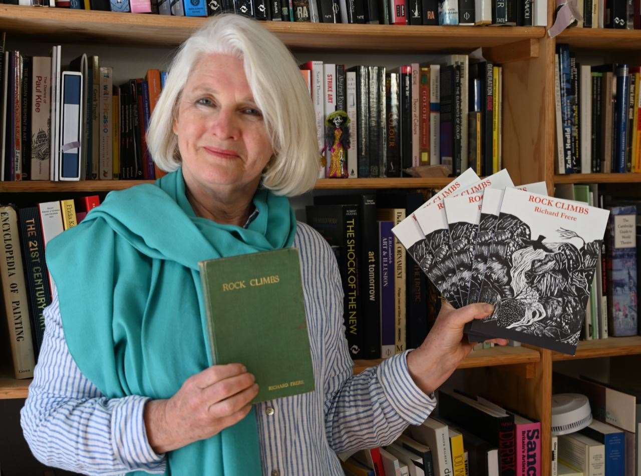 Jane Frere with her father's book Rock Climbs and copies of the re-issued version.