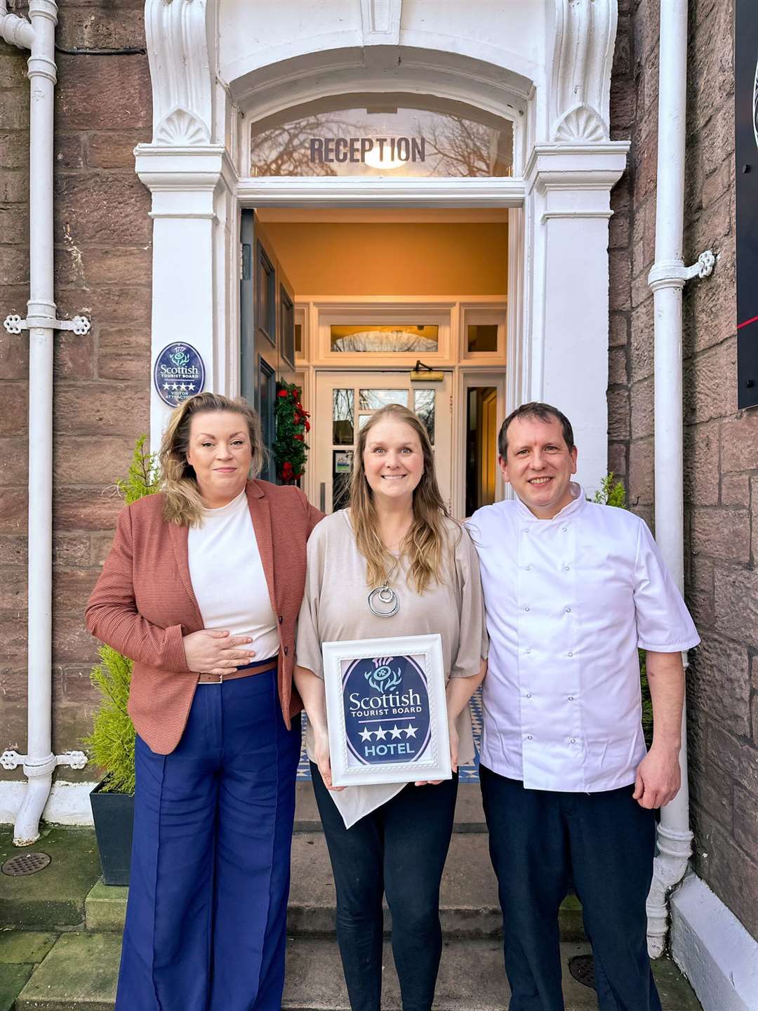 Glen Mhor Hotel owner Victoria Erasmus (centre) celebrates the 4 Star rating with Operations Manager, Deirdre Lee (left) and Executive Chef, Andrew Lee (right).