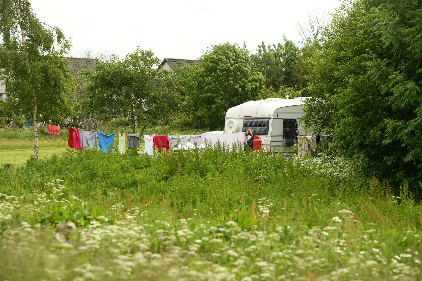 A washing line and caravan on open space behind Bun-sgoil Ghàidhlig Inbhir Nis – the Gaelic School. Picture: James Mackenzie