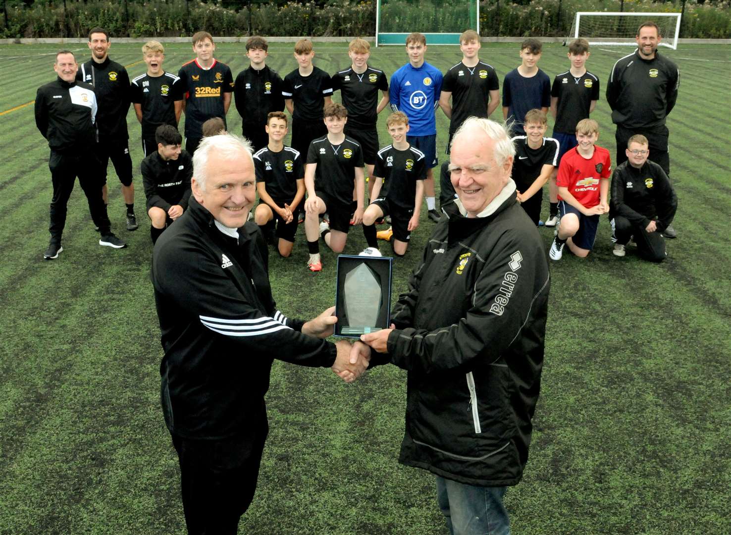 Head of Clachnacuddin Youth Development Bobby Beckwith presents Alan Gillies with an award for 17 years of service to the club. Picture: James Mackenzie.