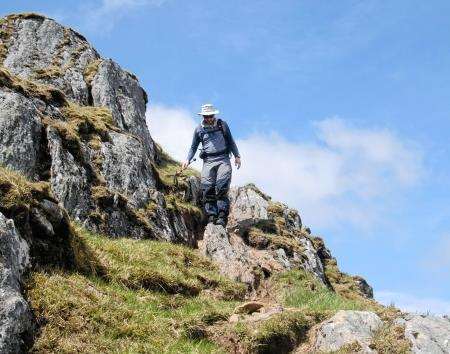 John descends the rocky path off Meall Buidhe.