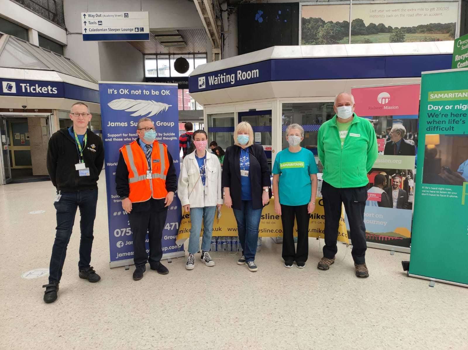 Volunteers at Inverness train station raising awareness of suicide prevention.