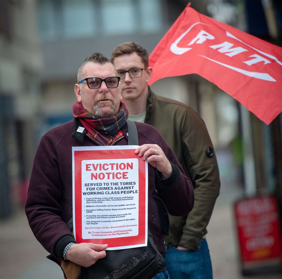 Trade unionists with a symbolic government ‘eviction notice’.