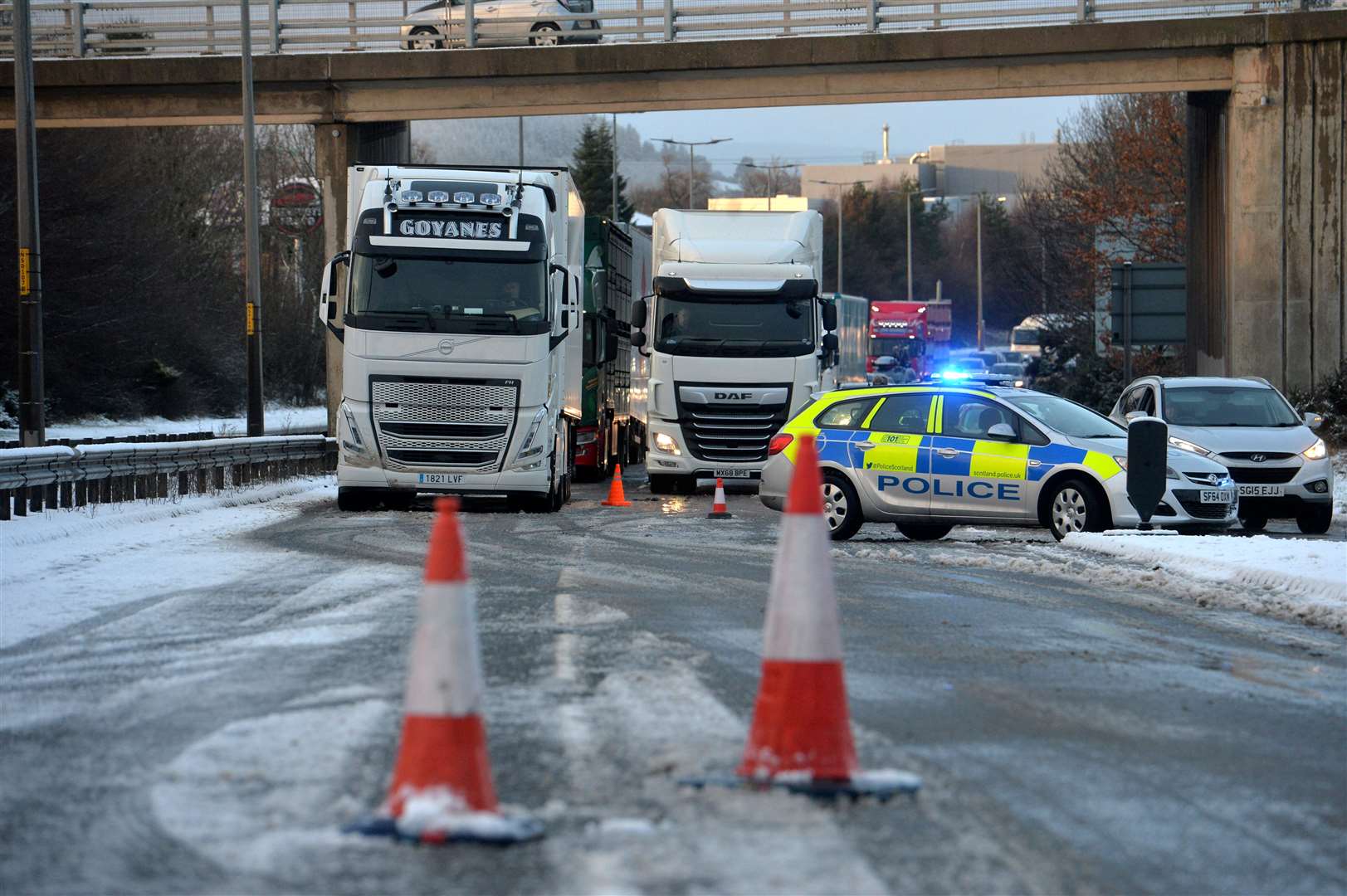 Police direct traffic after tricky road conditions resulted in the closure of the A9 at Inshes.