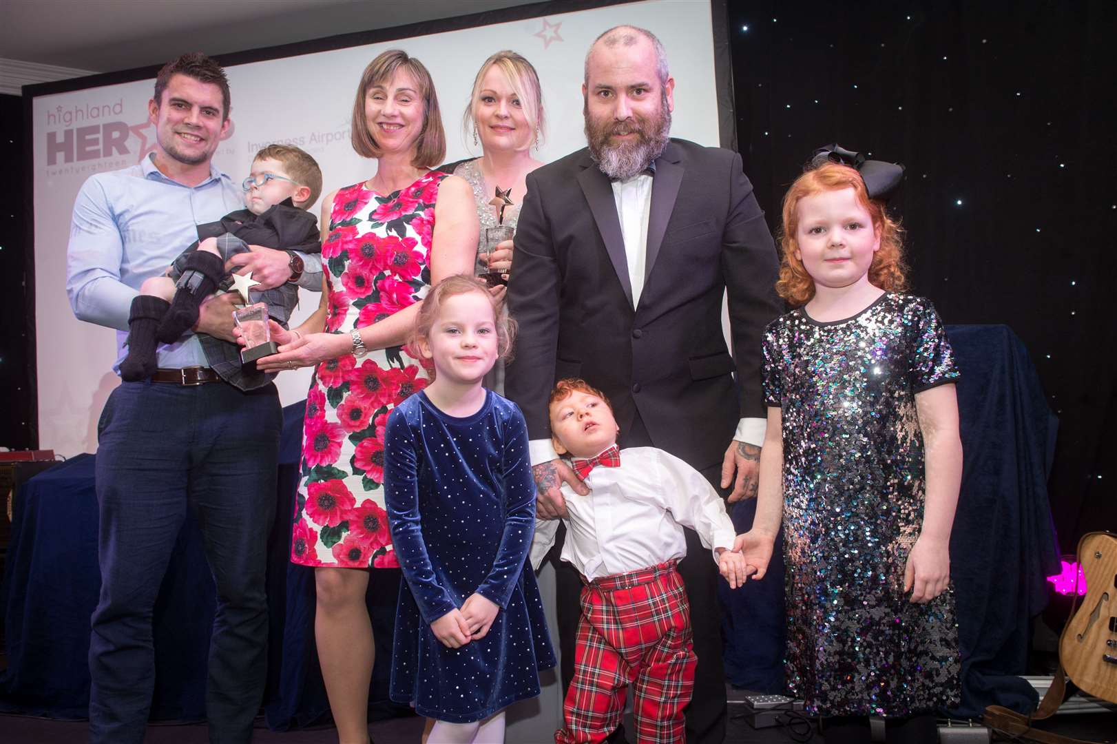 Leo Flett and Sam Douglas with their family receiving the Highland Heroes brave child award at last year’s event. Photo: Callum Mackay/SPP