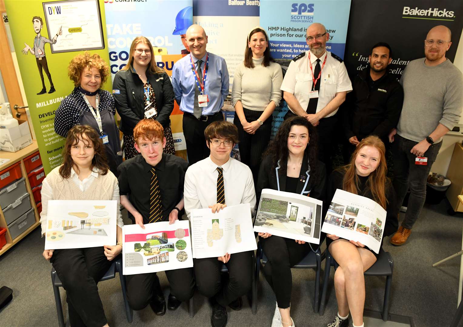 Pupils with their design work, accompanied by members of DYW, Balfour Beatty, the Scottish Prison Service and BakerHicks. Picture: James Mackenzie