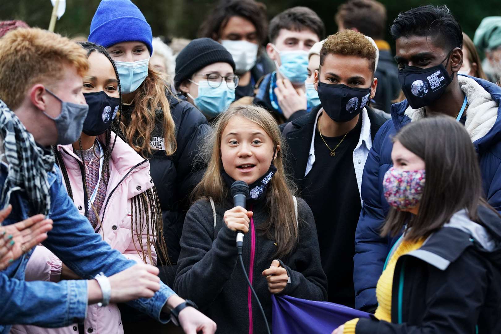 Greta Thunberg alongside fellow climate activists during a demonstration at Festival Park on the first day of the summit (Andrew Milligan/PA)