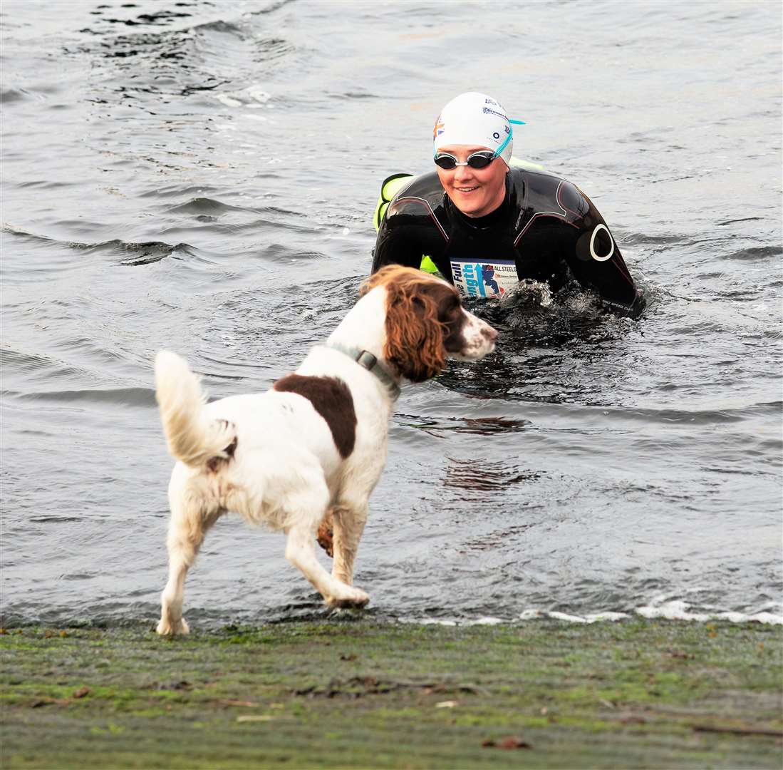 Jasmine Harrison arrives at John O Groats after swimming the length of the UK from Lands End and is greeted by her dog, Bonnie. Picture: Simon Price/Firstpix