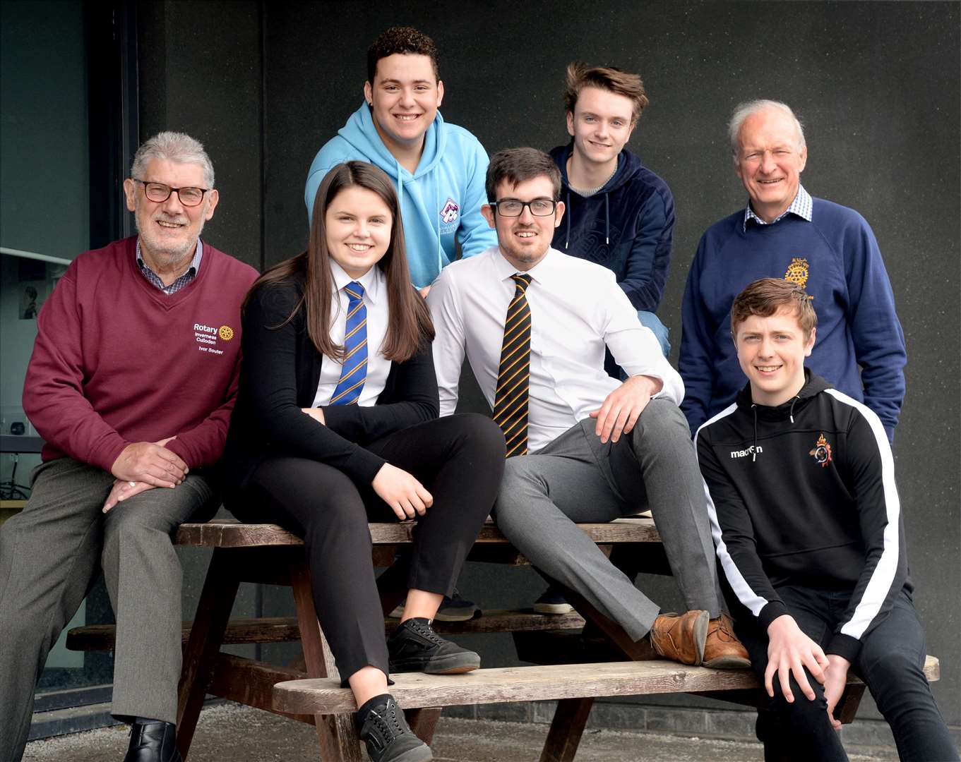 Five of the six students set to take part in the summer leadership programme with Rotary members Ivor Souter (left) and David Henderson (right).