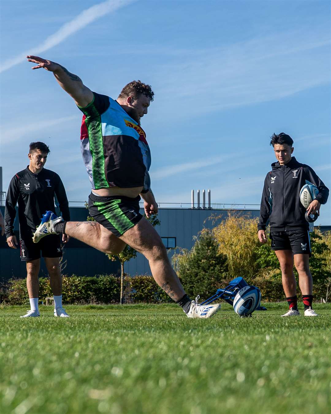 Tom lines up a kick during training, discovering it's not as easy as it looks!