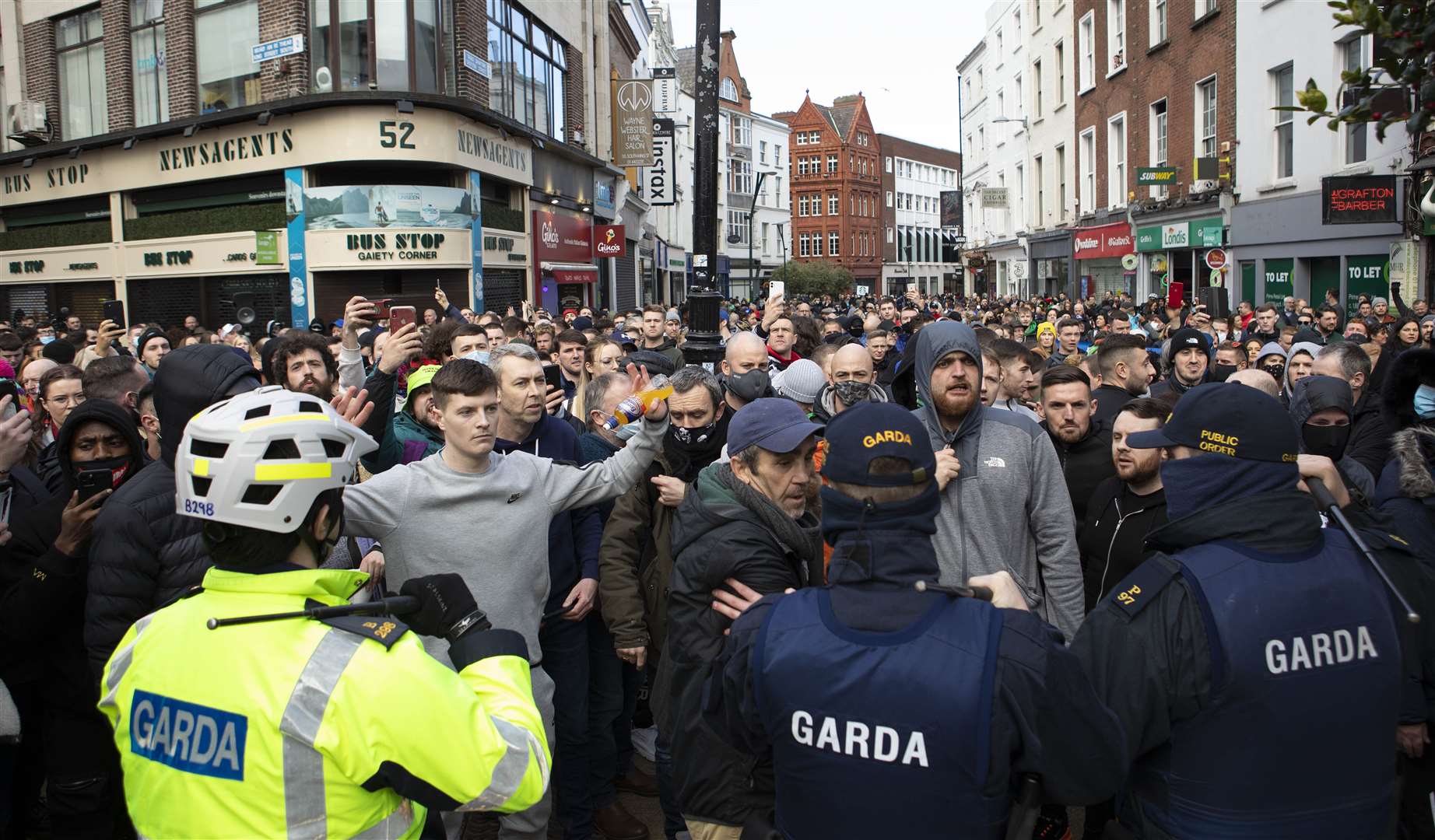 Gardai talk to protesters during an anti-lockdown protest in Dublin city centre (Damian Eagers/PA)