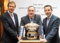 The European Tour chief executive George O'Grady (left), Scotland's First Minister Alex Salmond and Ian Stuart, head of Barclays Corporate UK, are pictured with the new Scottish Open trophy