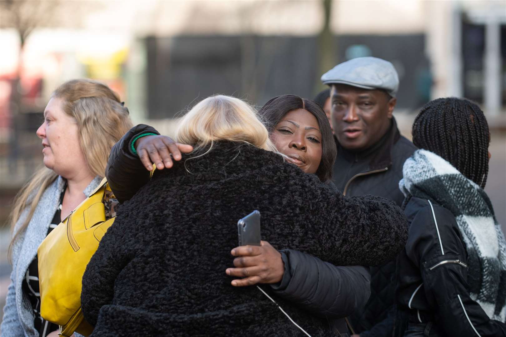 The family of Dom Ansah emabraced outside Luton Crown Court after the sentencing (Joe Giddens/PA)