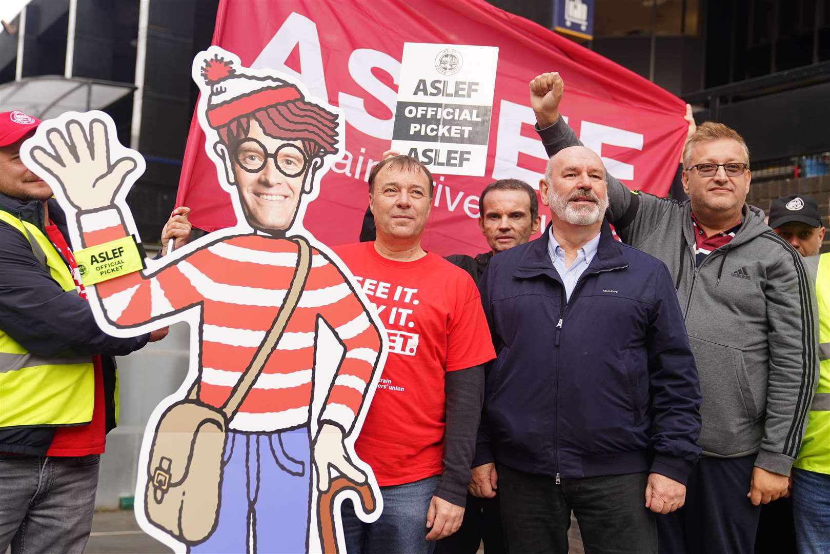 Aslef general secretary Mick Whelan (second right) on a picket line at Euston station in London (James Manning/PA)