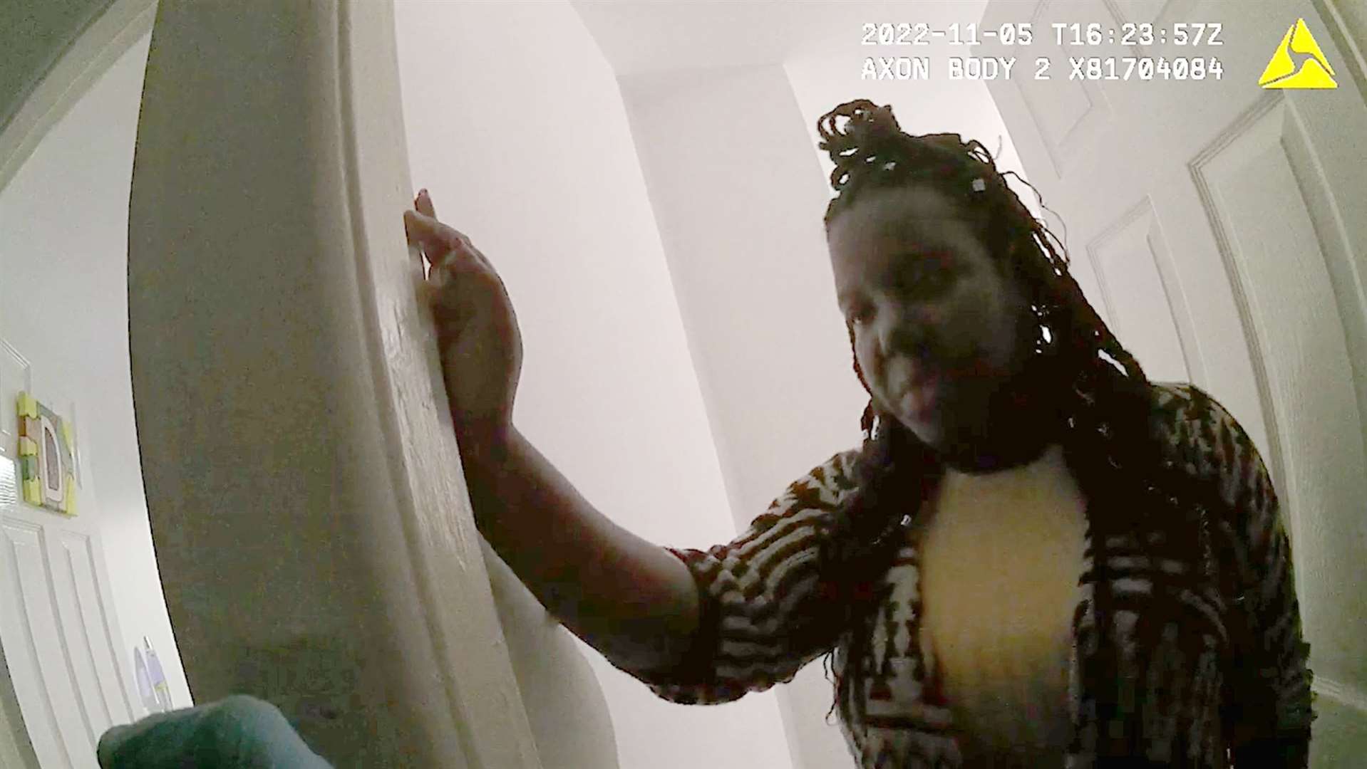 Police body-worn camera footage shows Christina Robinson speaking to an officer as paramedics try to save her son’s life nearby (Crown Prosecution Service/PA)