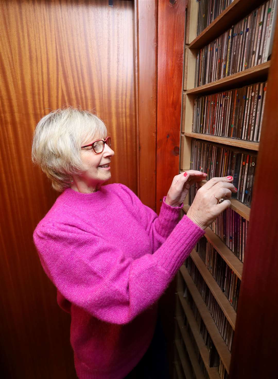 Helen MacPherson looking through the CDs in her extensive music collection. Picture: James Mackenzie