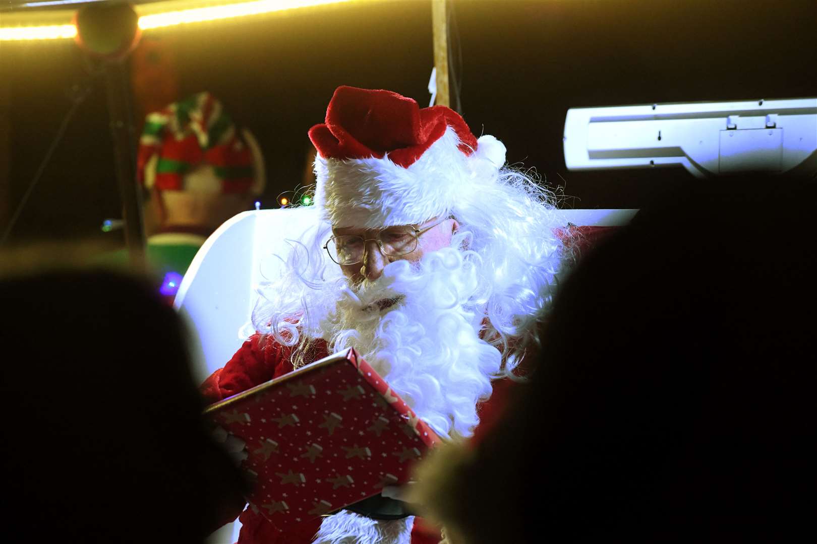 Santa reading out the names on his presents. Picture: James Mackenzie