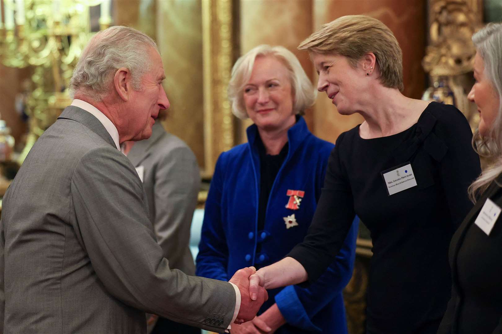 Dame Ruth May with the King (Toby Melville/PA)