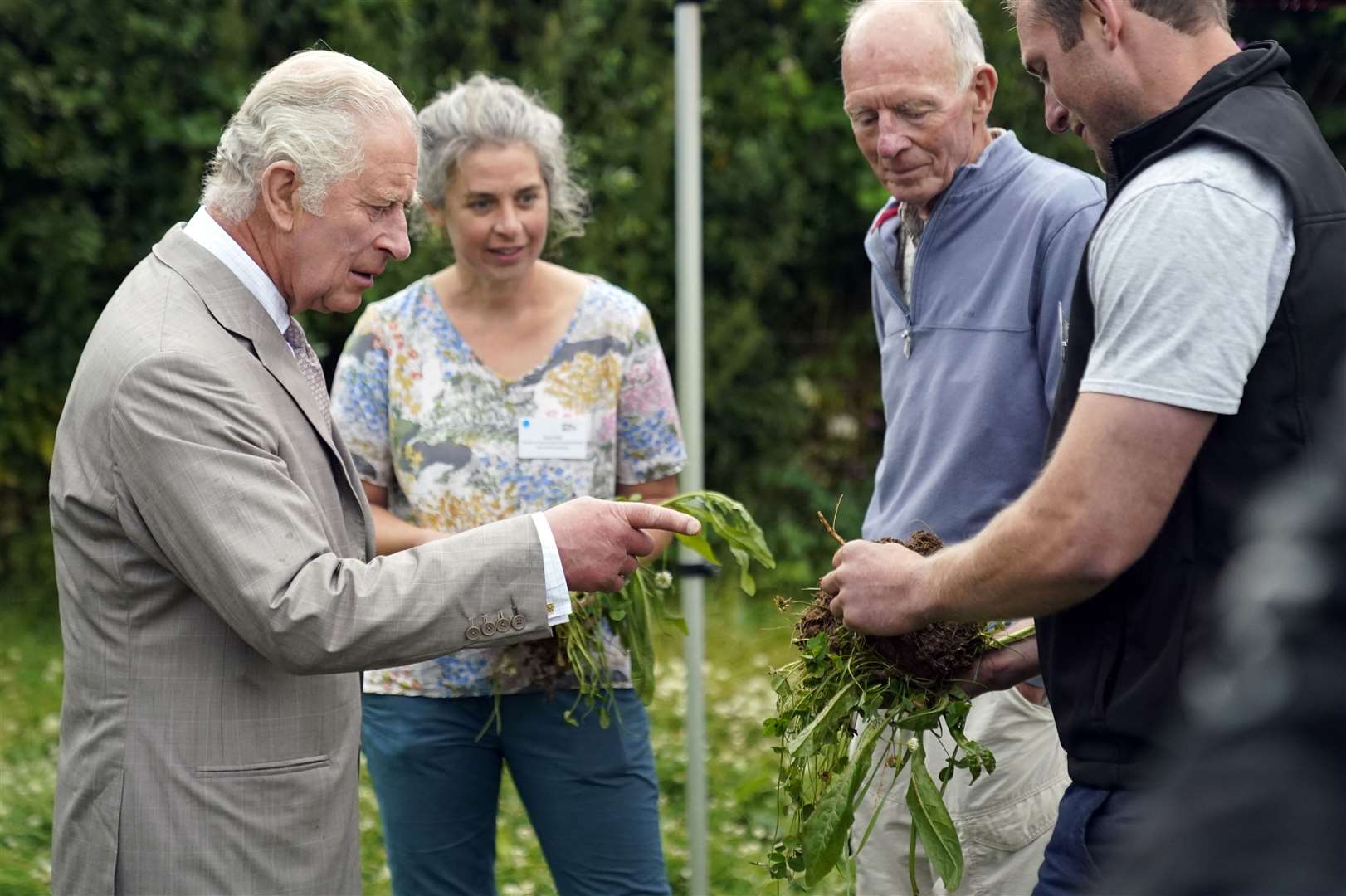 Charles is shown samples of herbal leys as he attends the Innovative Farmers 10th anniversary at Trefranck Farm (Andrew Matthews/PA)