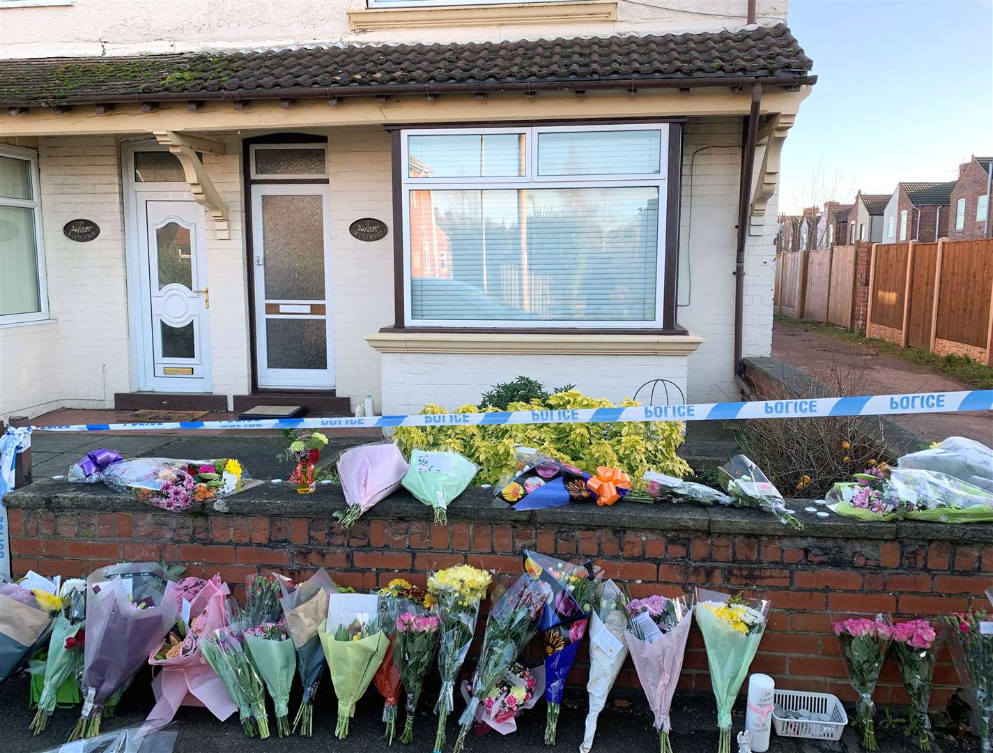Flowers outside a house on Station Road, Langwith Junction (Josh Payne/PA)