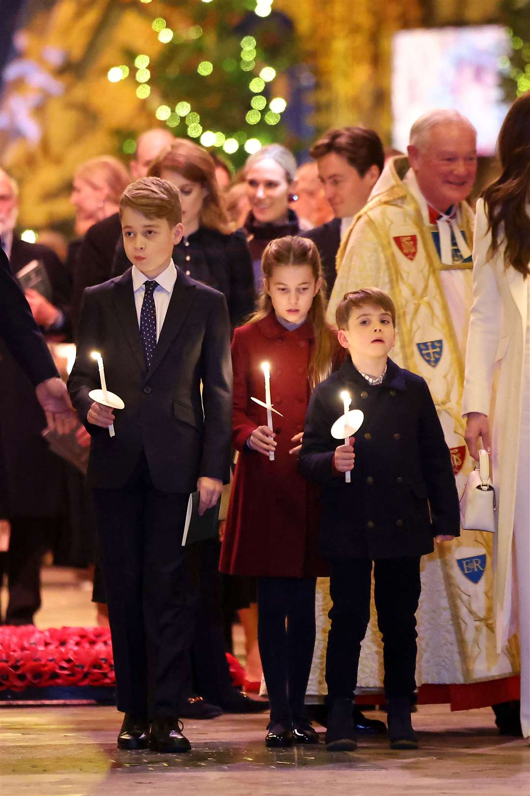 Prince George, Princess Charlotte and Prince Louis hold candles during the Royal Carols – Together At Christmas service at Westminster Abbey (Chris Jackson/PA)