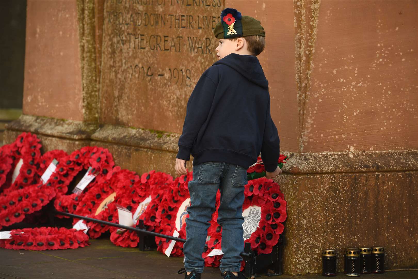 A youngster pays respect in Inverness. Picture: James Mackenzie