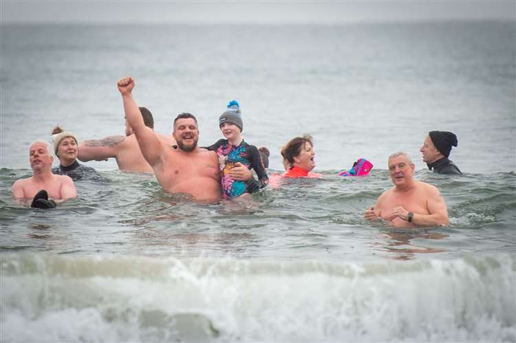 PICTURES: Strongman brothers Tom and Luke Stoltman make a splash with  Highland New Year's Day dip