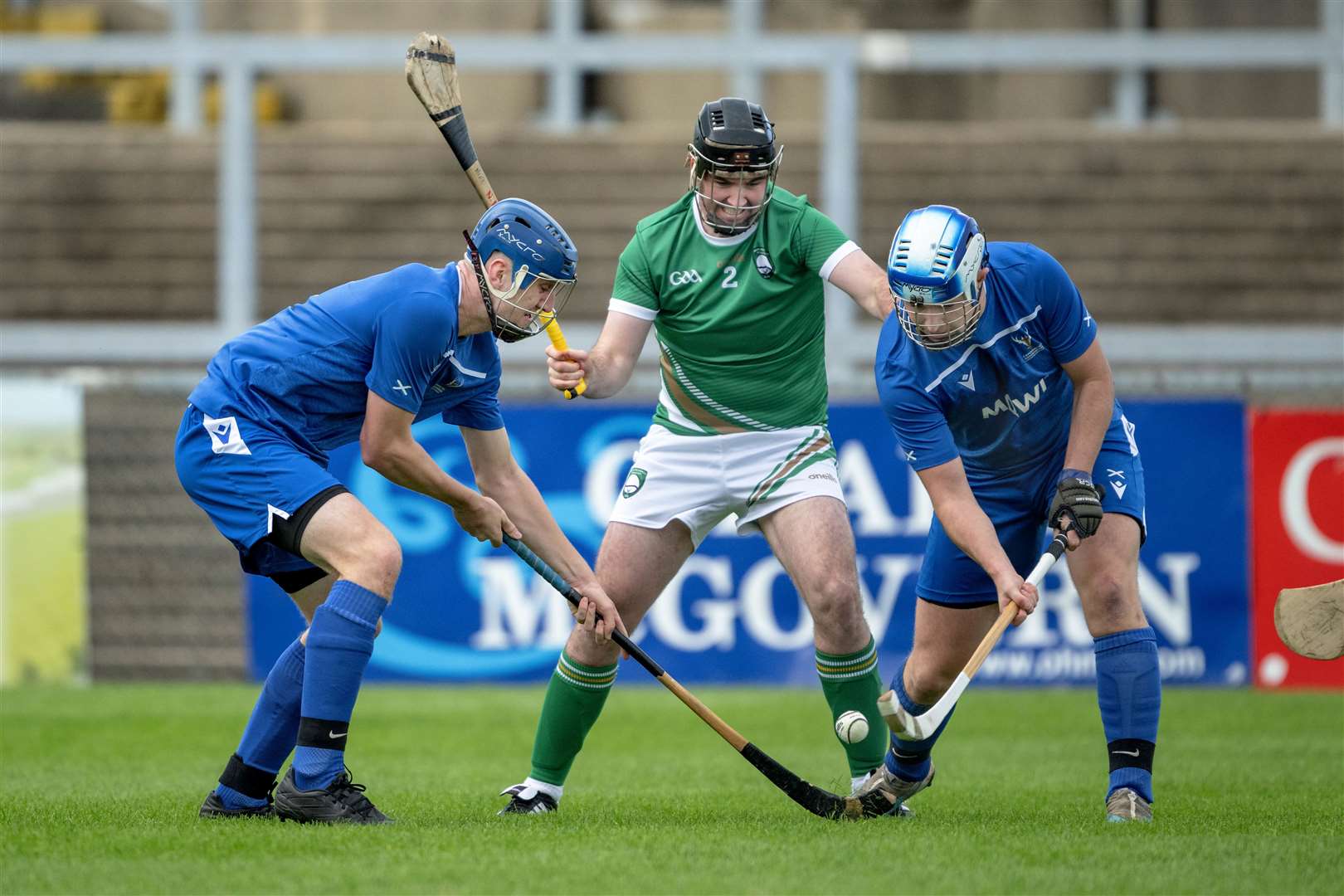 Scotland's Robert Mabon (left) and John Gillies keep the ball from Niall Arthur (Ireland) at Pairc Esler, Newry. Picture: Neil Paterson