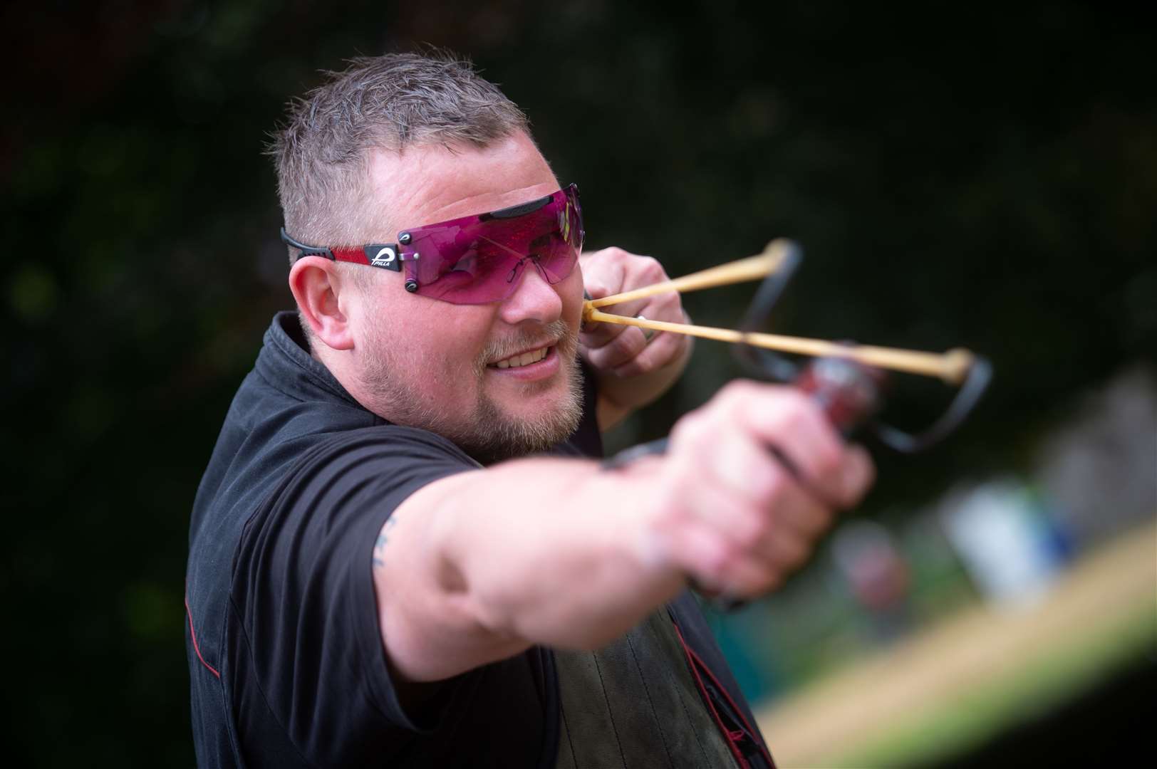 Taking aim with a sling shot at last year's Moy Country Fair.