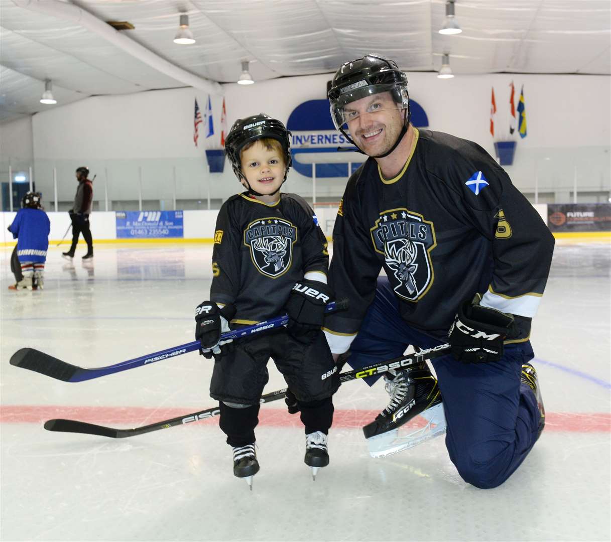 Elliot and dad Jamie Brown take to the ice. Picture Gary Anthony.